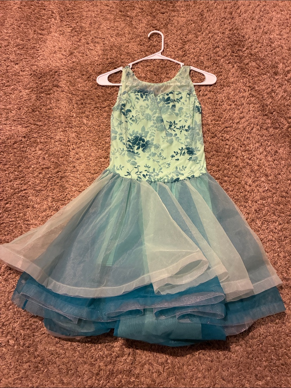 Women’s green and blue lyrical dance costume.